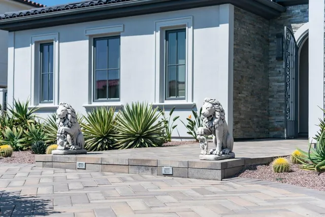 a front view of a house with yard and porch