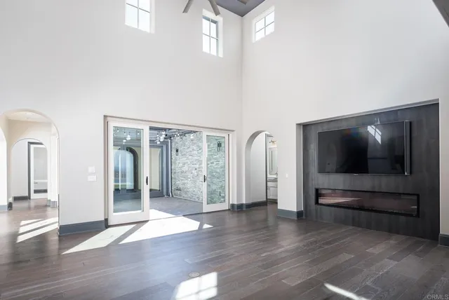 a kitchen with granite countertop a sink stainless steel appliances and cabinets