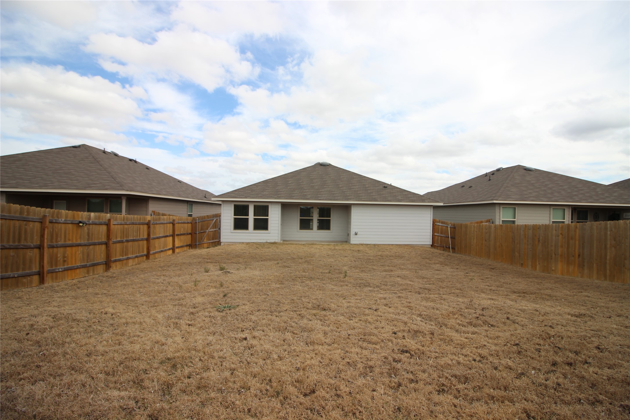 602 Wyatt Way Jarrell, TX 76537 - Photo 6 of 8 Back of house featuring a fenced backyard