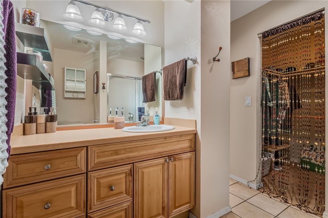 3408 Sunriver Road, Unit 208 Bullhead City, AZ 86429 - Photo 23 of 47 a bathroom with a sink and a mirror