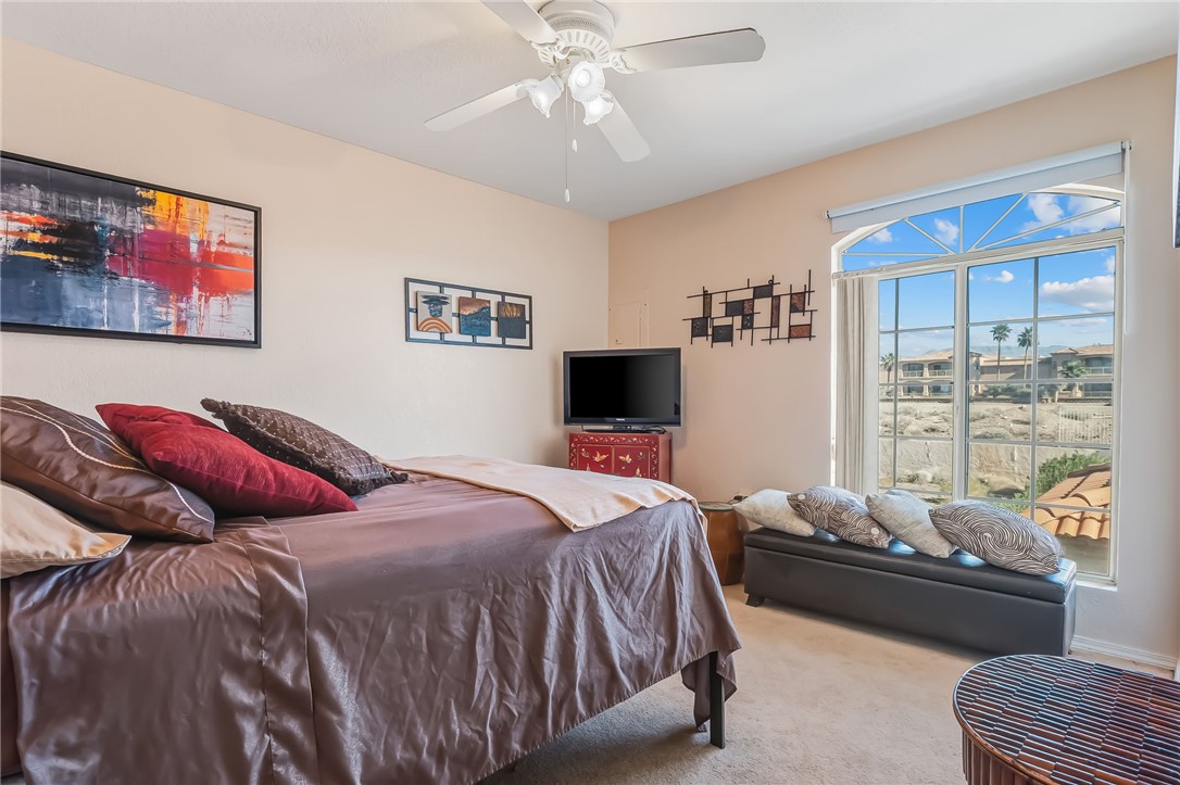 3408 Sunriver Road, Unit 208 Bullhead City, AZ 86429 - Photo 24 of 47 a bedroom with a bed and a couch
