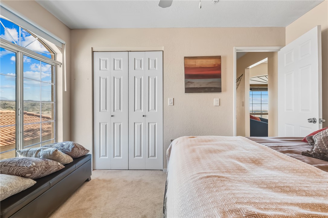 3408 Sunriver Road, Unit 208 Bullhead City, AZ 86429 - Photo 25 of 47 a bedroom with a bed and a couch