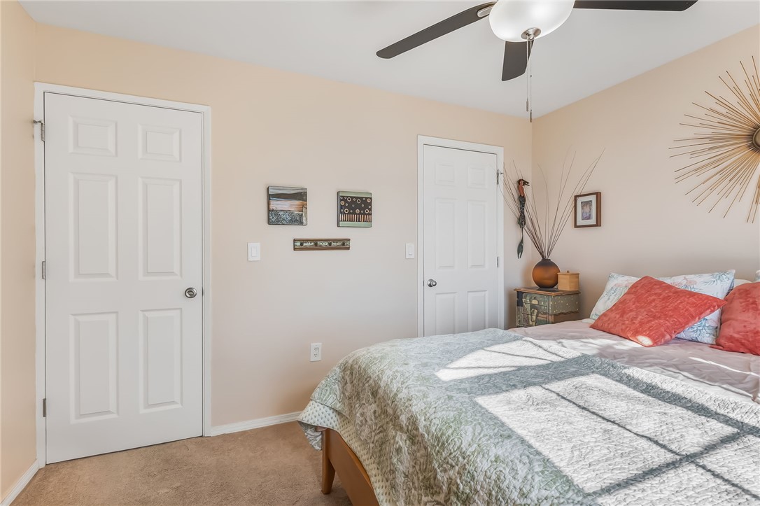 3408 Sunriver Road, Unit 208 Bullhead City, AZ 86429 - Photo 29 of 47 a bedroom with a bed and a painting on the wall