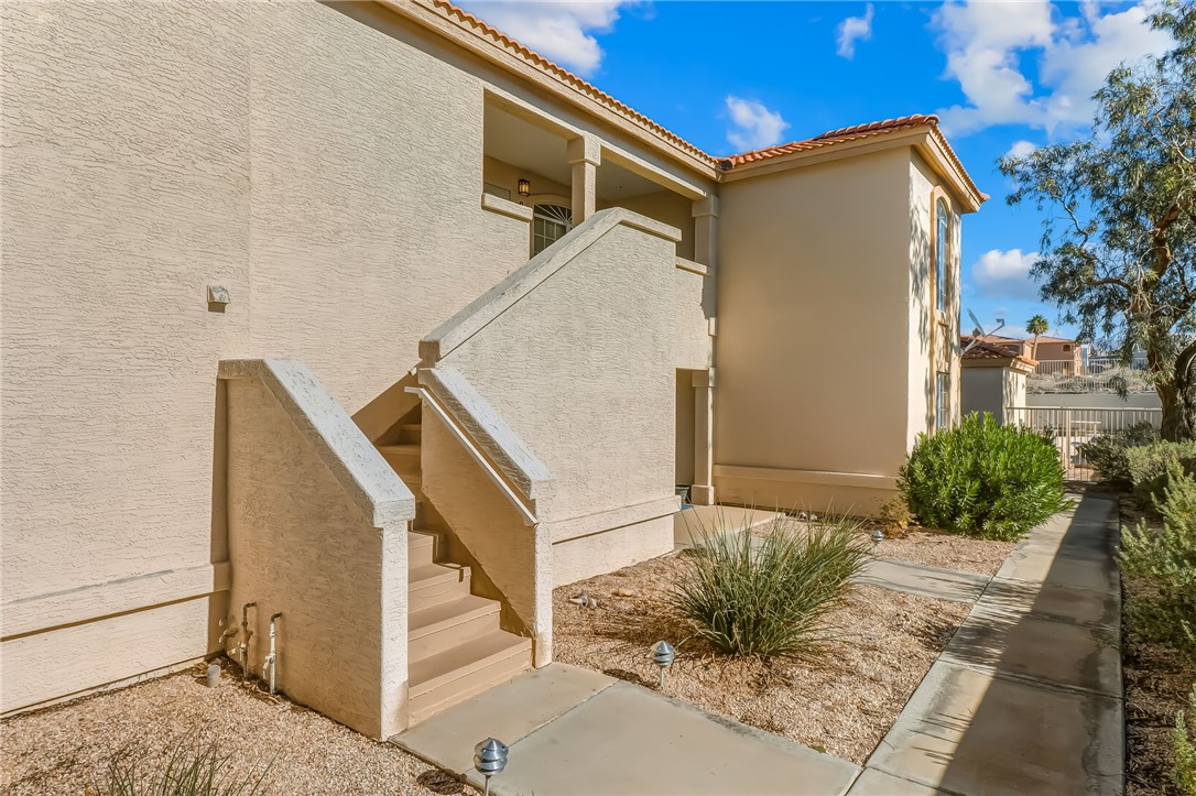 3408 Sunriver Road, Unit 208 Bullhead City, AZ 86429 - Photo 4 of 47 a view of a house with a small garden