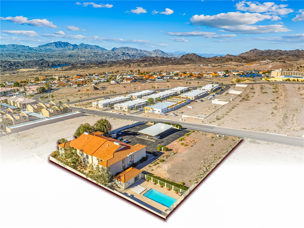 3408 Sunriver Road, Unit 208 Bullhead City, AZ 86429 - Photo 46 of 47 an aerial view of a residential houses with outdoor space