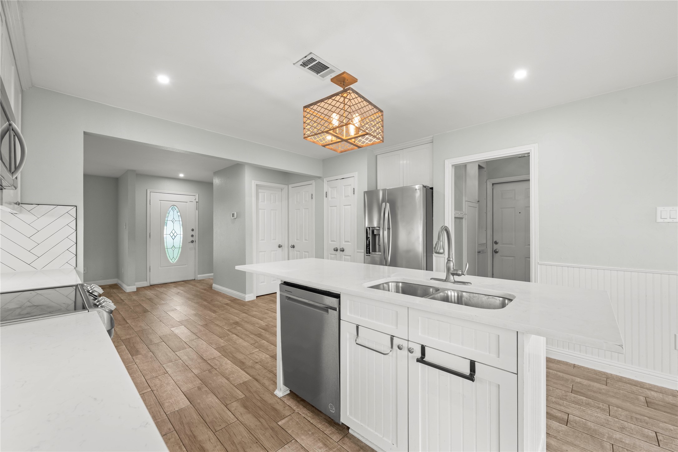 1329 Quail Ravine Round Rock, TX 78664 - Photo 15 of 39 Clean lines and durable wood-look tile flooring define this bright, updated cooking space.