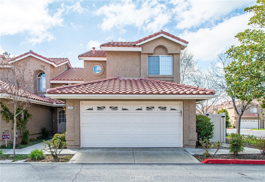 a front view of a house with a garage