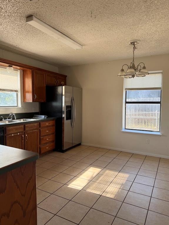 11204 Liberty School Road Pelican Bay, TX 76020 - Photo 6 of 23 a kitchen with stainless steel appliances granite countertop a stove a sink and a microwave