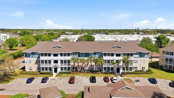 an aerial view of residential houses and outdoor space