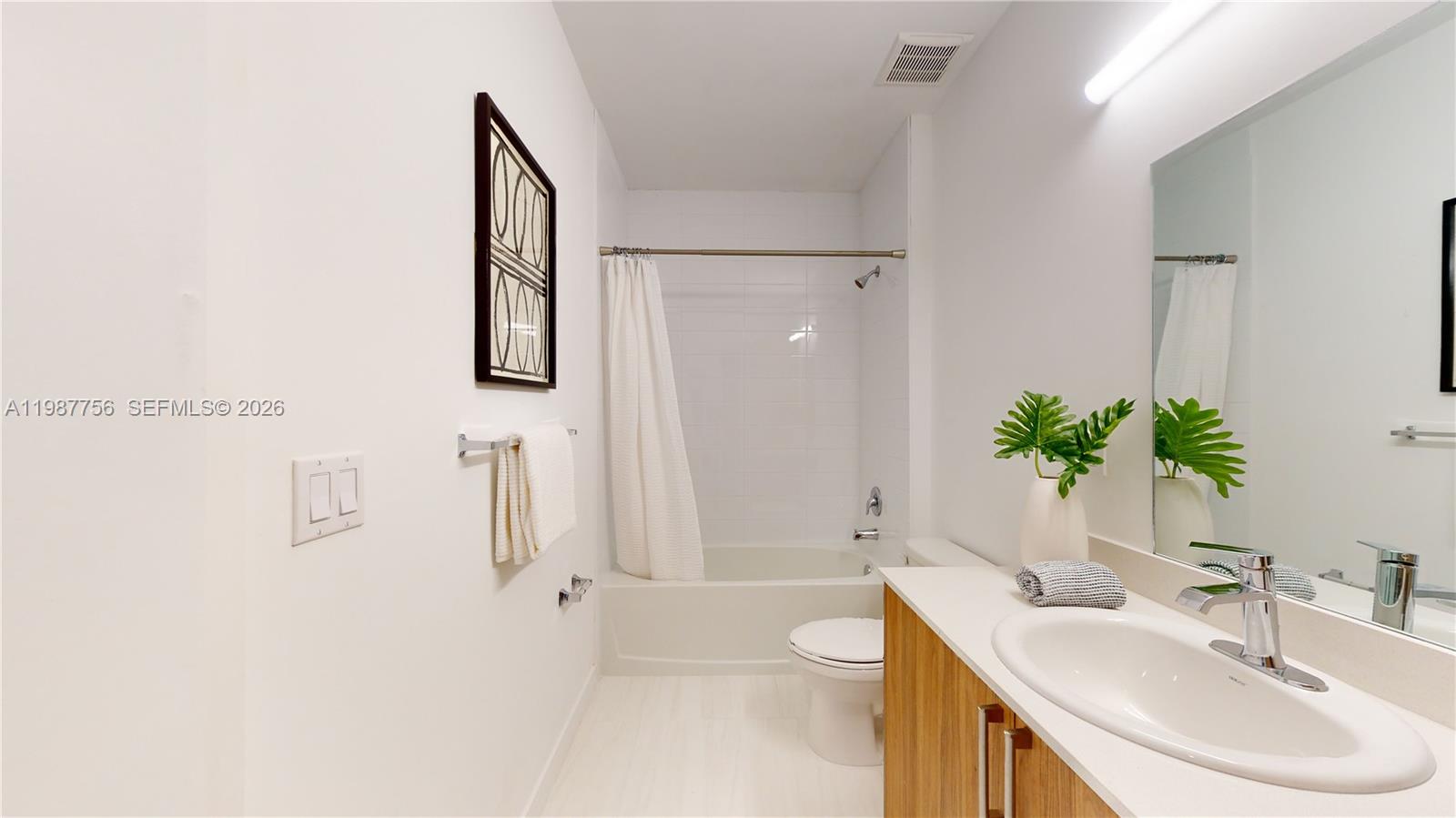 24705 Southwest 129th Avenue, Unit 110 Homestead, FL 33032 - Photo 24 of 33 a bathroom with a sink toilet and shower