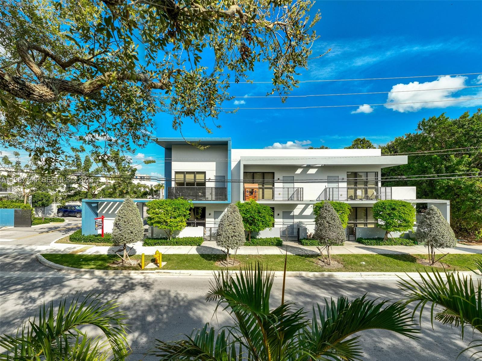 24705 Southwest 129th Avenue, Unit 110 Homestead, FL 33032 - Photo 30 of 33 a view of a house with backyard sitting area and swimming pool