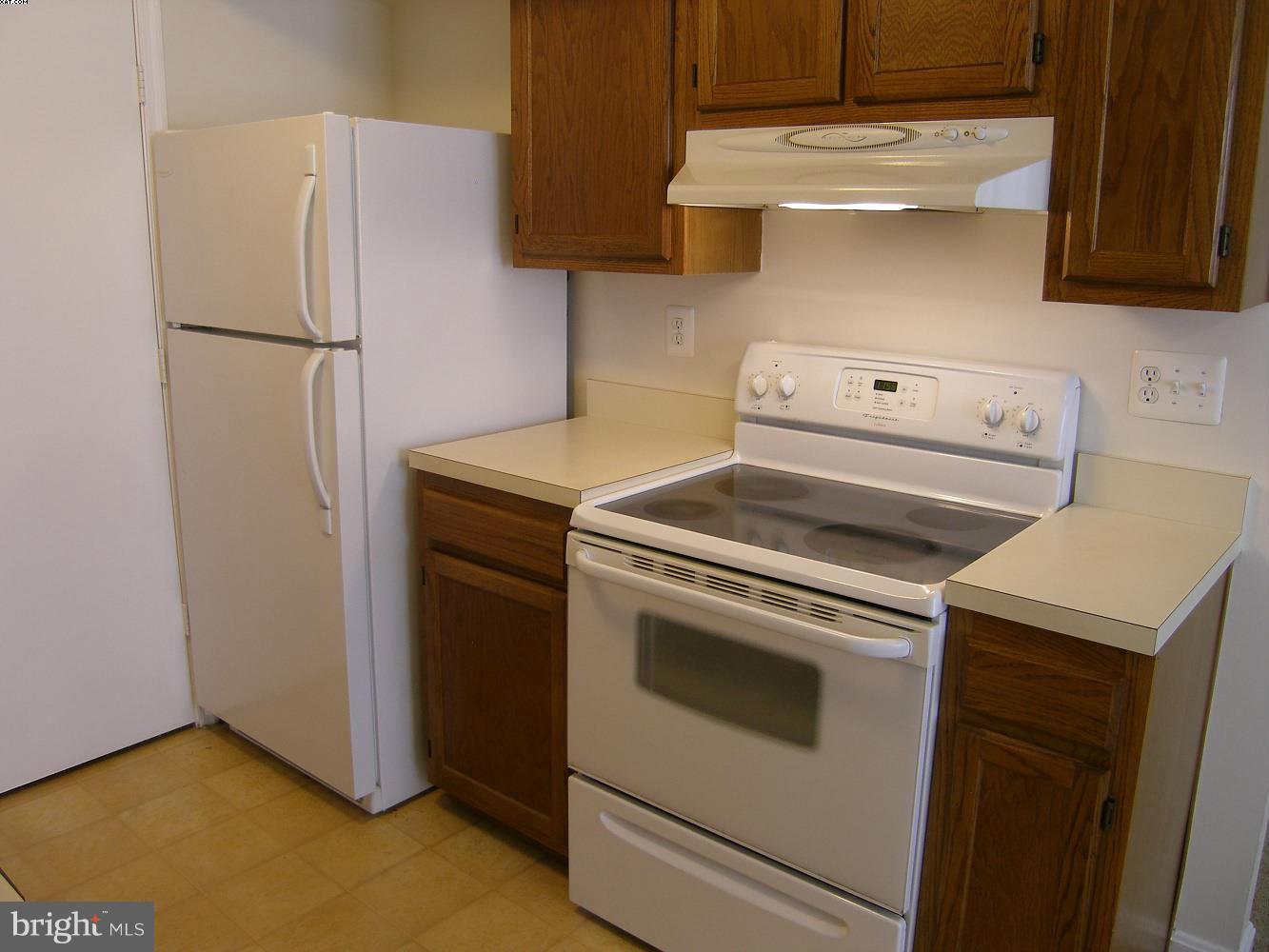 14906 McKisson Court, Unit B Silver Spring, MD 20906 - Photo 11 of 27 a view of a kitchen with washer and dryer