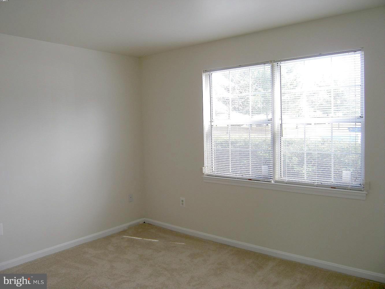 14906 McKisson Court, Unit B Silver Spring, MD 20906 - Photo 13 of 27 an empty room with a window