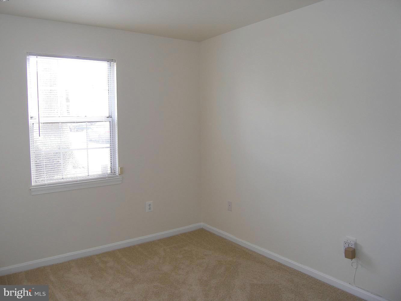 14906 McKisson Court, Unit B Silver Spring, MD 20906 - Photo 15 of 27 an empty room with a window