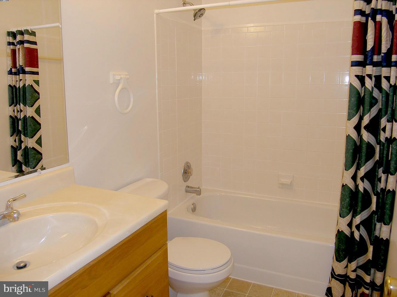 14906 McKisson Court, Unit B Silver Spring, MD 20906 - Photo 17 of 27 a bathroom with a sink a toilet and a bathtub
