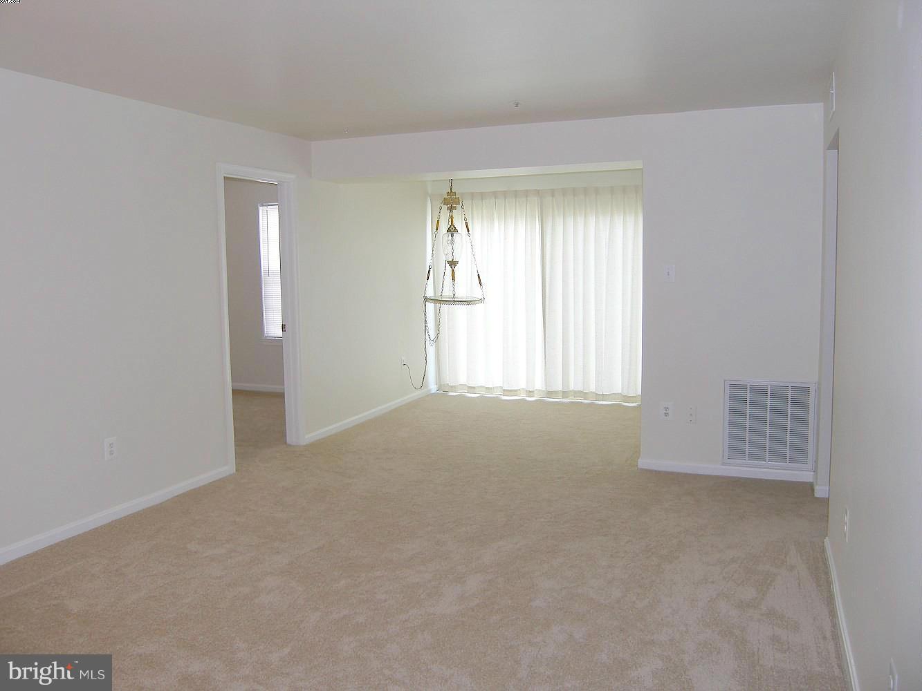 14906 McKisson Court, Unit B Silver Spring, MD 20906 - Photo 3 of 27 a view of an empty room with a window