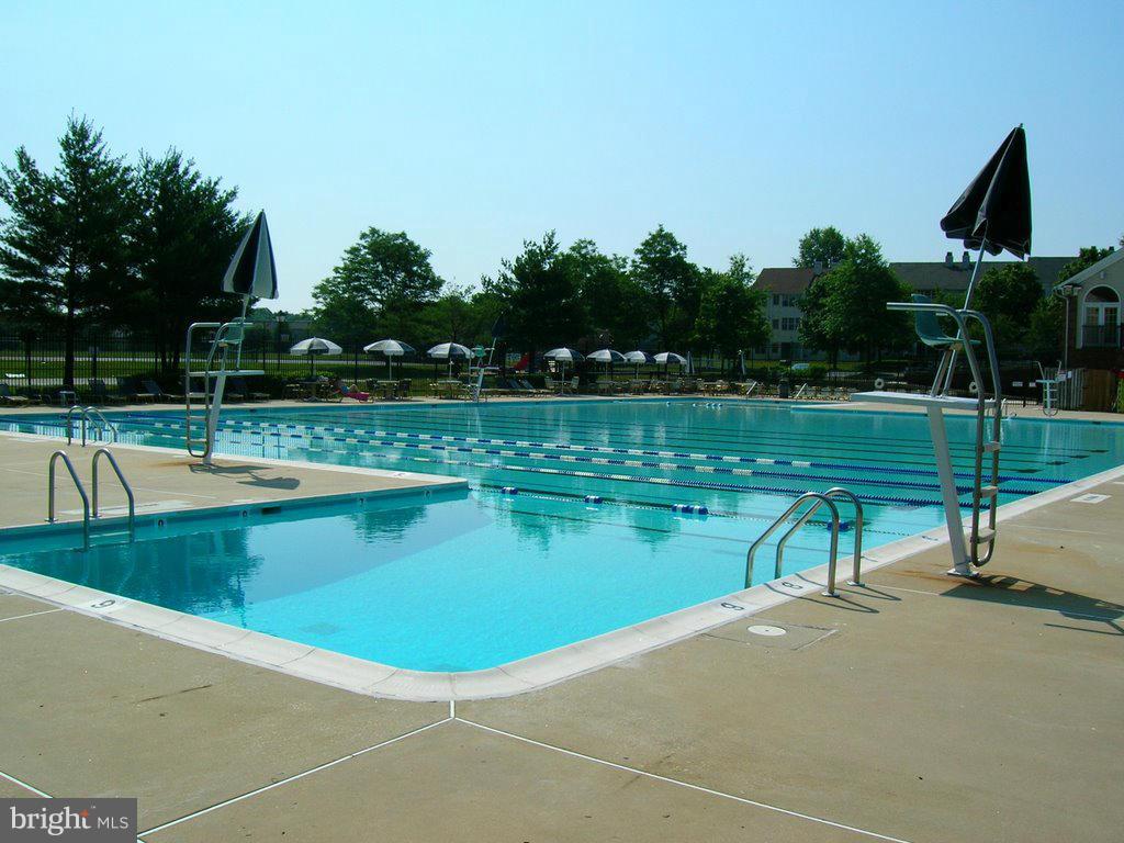 14906 McKisson Court, Unit B Silver Spring, MD 20906 - Photo 23 of 27 a view of a swimming pool with a lake