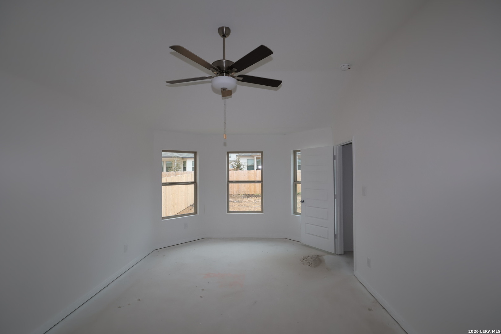 3019 Wembley Way Converse, TX 78109 - Photo 16 of 27 an empty room that has a window and a fan