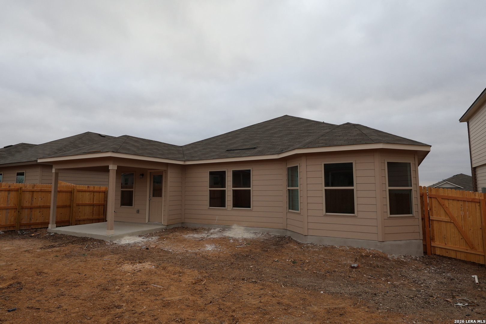 3019 Wembley Way Converse, TX 78109 - Photo 25 of 27 a front view of a house with a yard and garage
