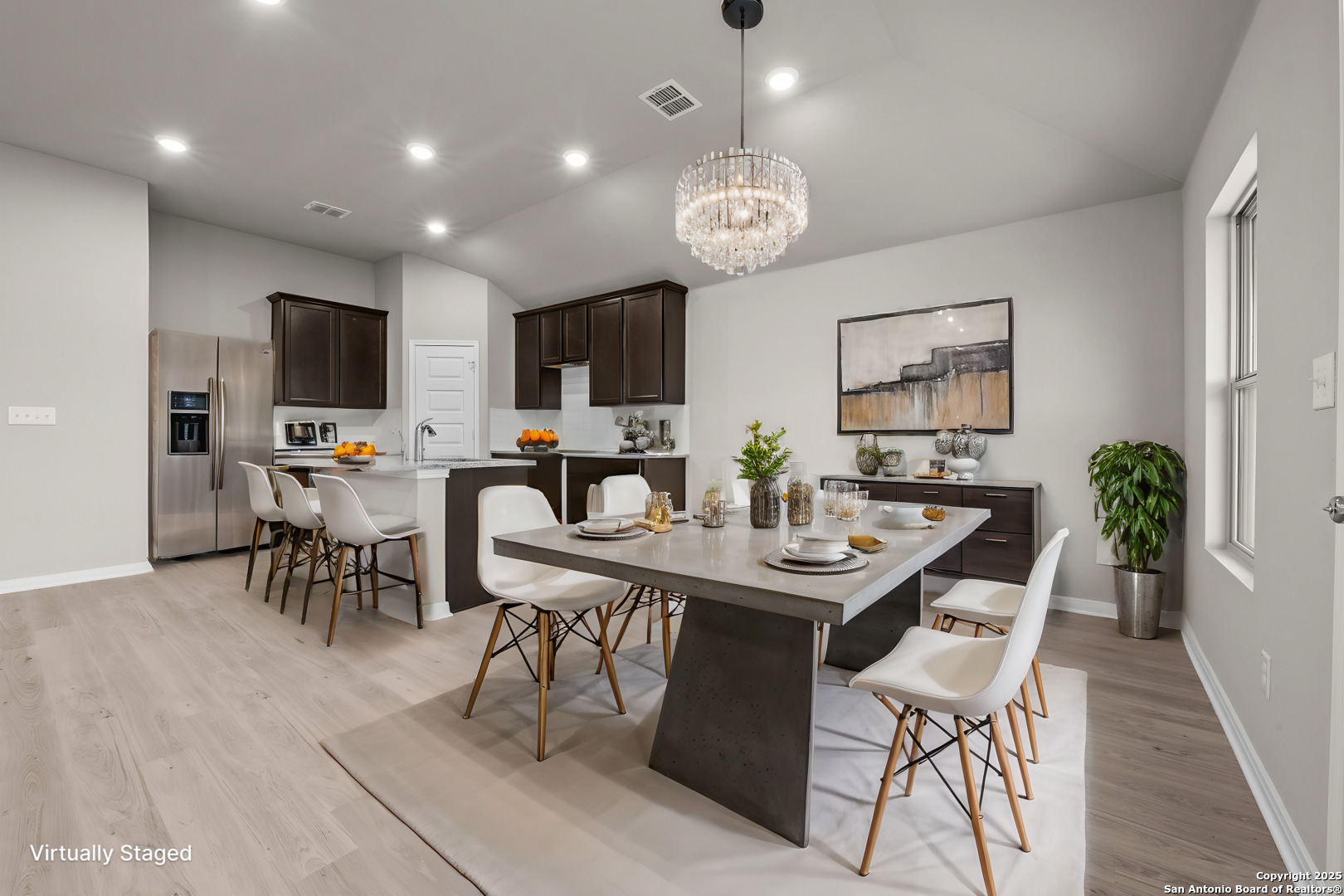 3019 Wembley Way Converse, TX 78109 - Photo 5 of 27 a view of a dining room with furniture and a chandelier