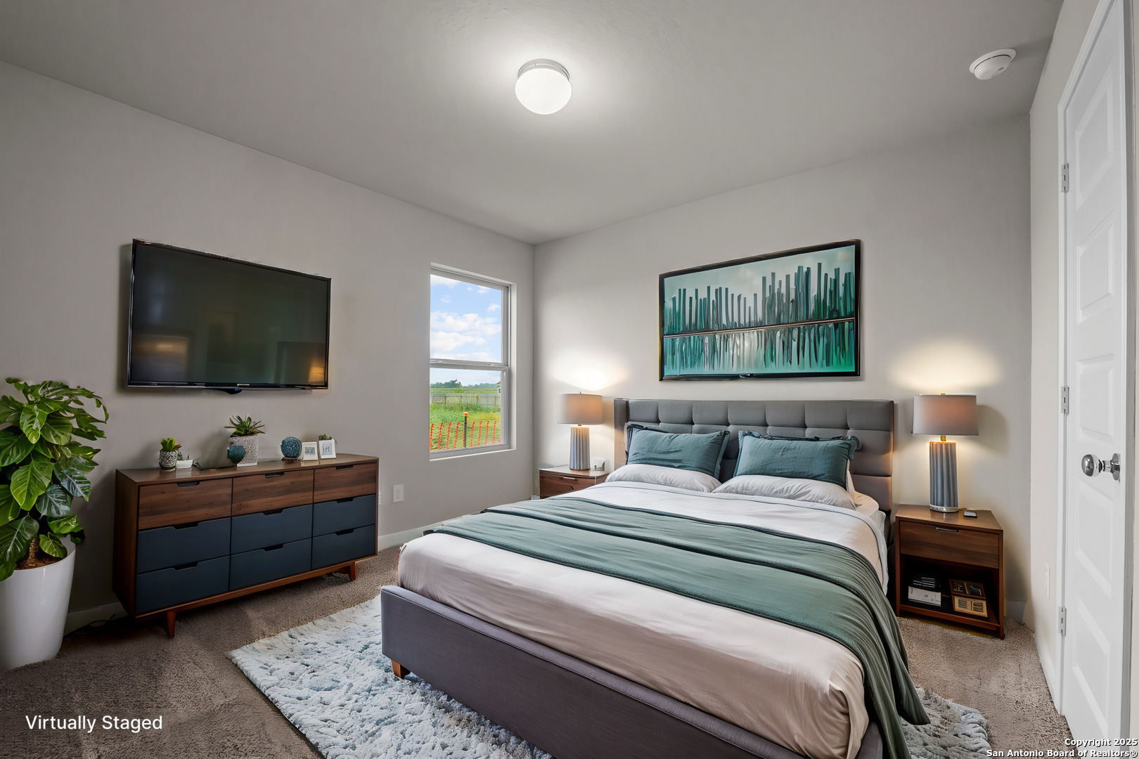 3019 Wembley Way Converse, TX 78109 - Photo 8 of 27 a bedroom with a bed and a flat screen tv