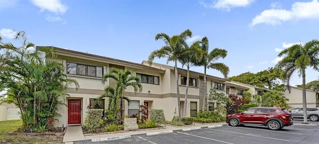 a view of a car park in front of a building