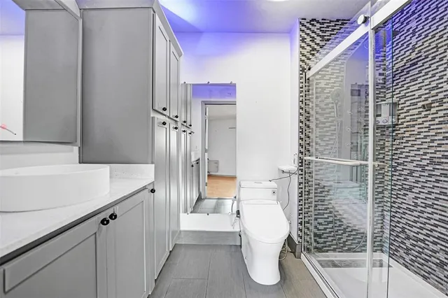 a bathroom with a bathtub and shower