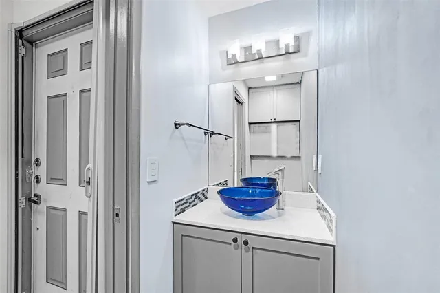 a kitchen with a sink and cabinets