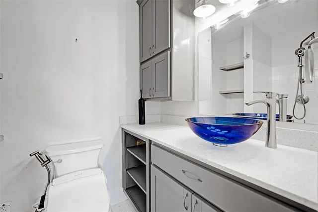 a kitchen with a sink and cabinets