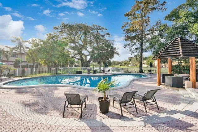 a view of a swimming pool with a patio