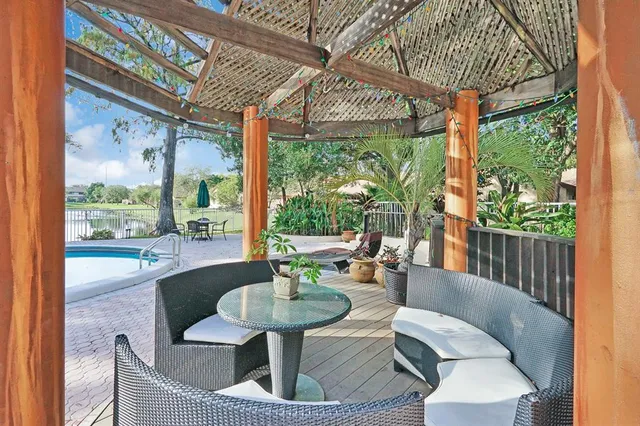 a front view of a house with yard and green space