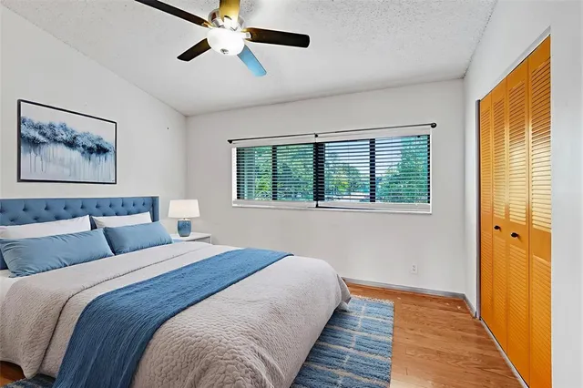 a bedroom with bed and window