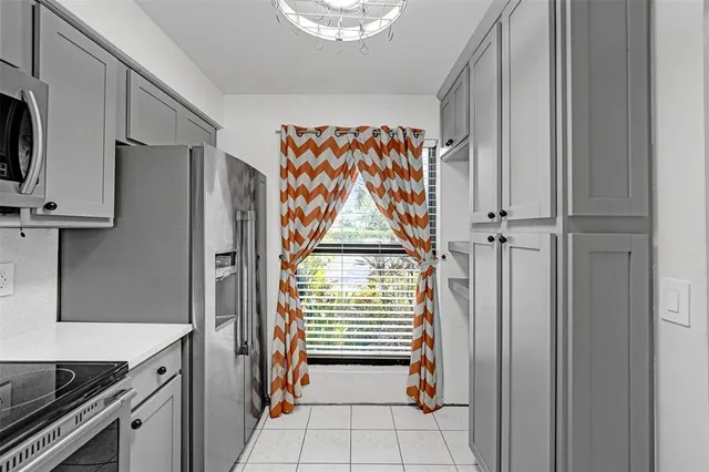 a view of front door with washer and dryer