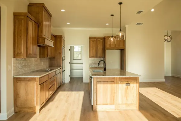 a bathroom with a double vanity sink a mirror and a shower