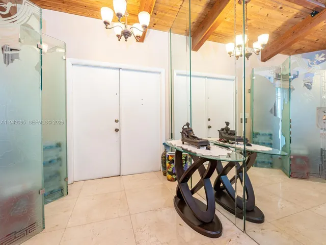 a kitchen filled with lots of appliances and furniture