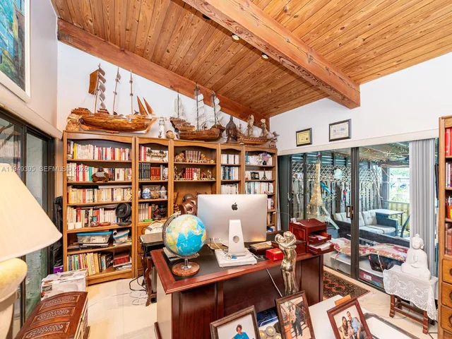 a view of a patio with a table chairs and a yard