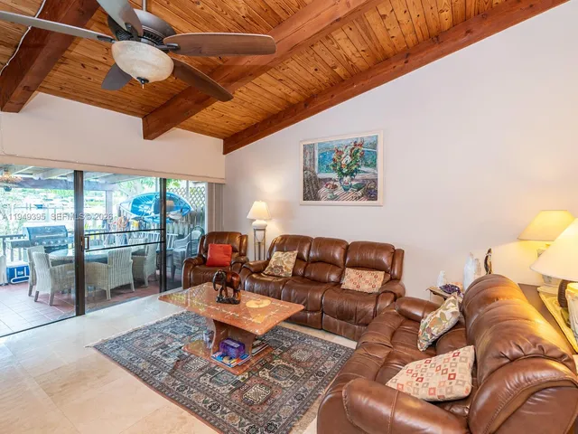a view of a swimming pool with a lounge chair