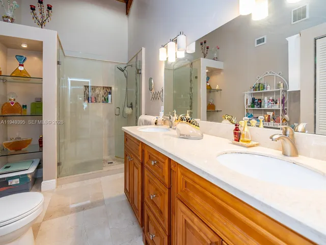 an aerial view of residential house with outdoor space and parking