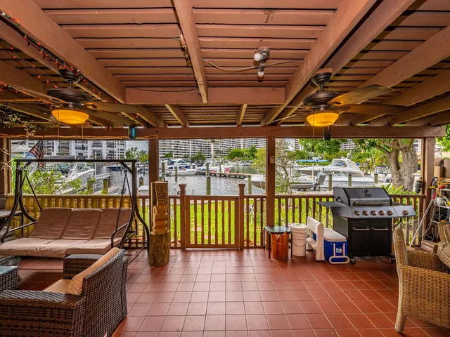 an aerial view of house with yard swimming pool and outdoor seating