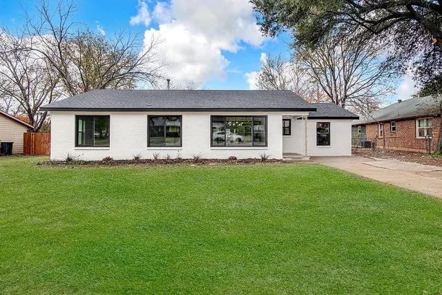 a front view of house with yard and green space