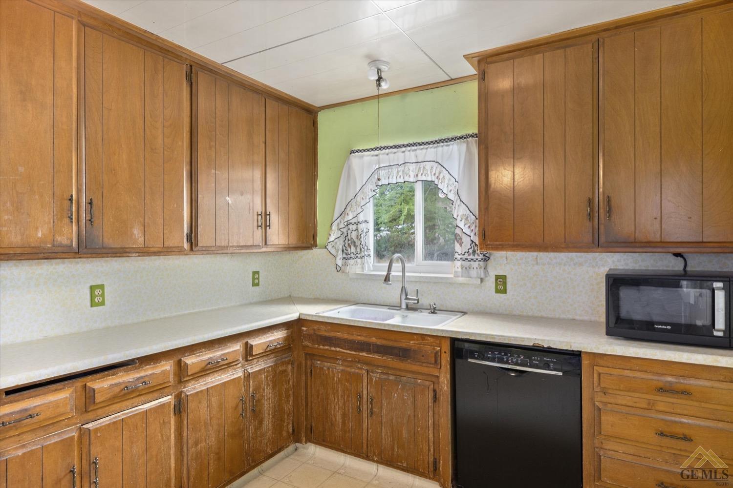 Undisclosed Address Taft, CA 93268 - Photo 14 of 21 a kitchen with a sink and cabinets
