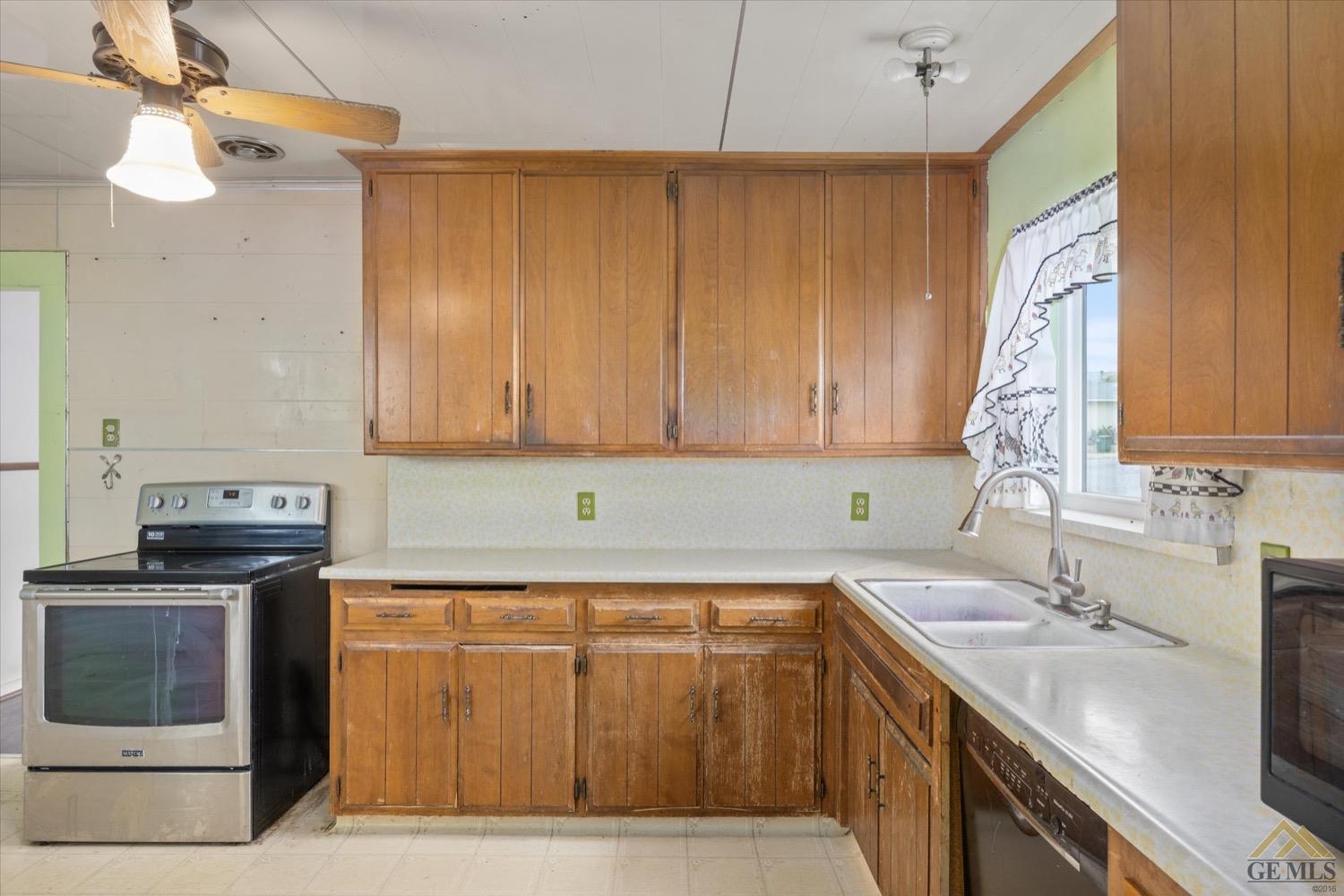 Undisclosed Address Taft, CA 93268 - Photo 15 of 21 a kitchen with a sink and cabinets