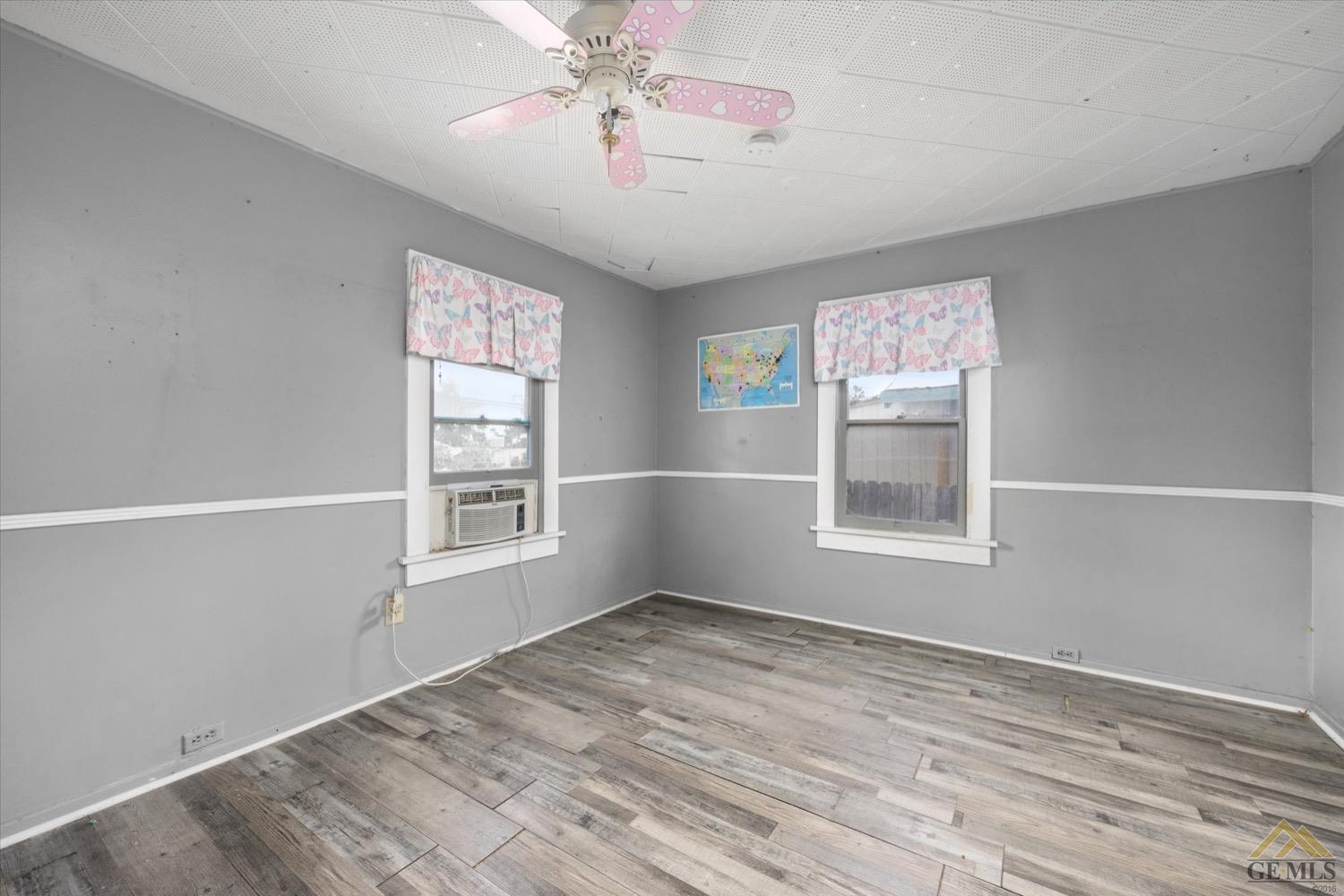 Undisclosed Address Taft, CA 93268 - Photo 17 of 21 a view of empty room with wooden floor and fan