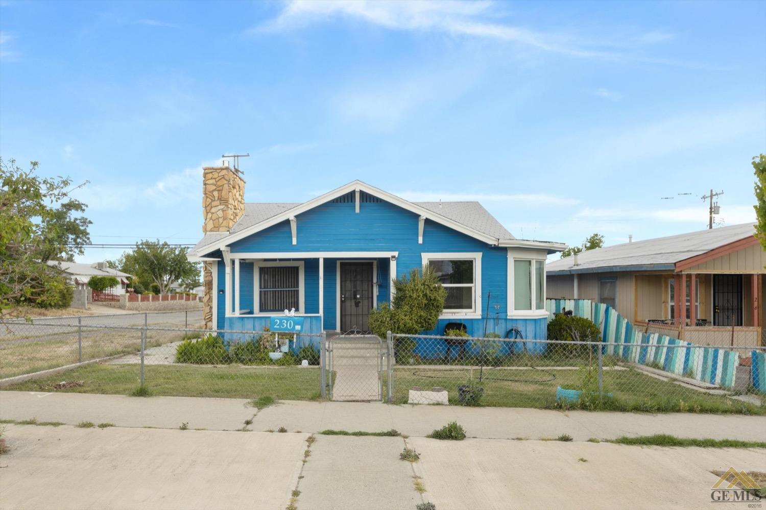 Undisclosed Address Taft, CA 93268 - Photo 2 of 21 front view of house with a yard