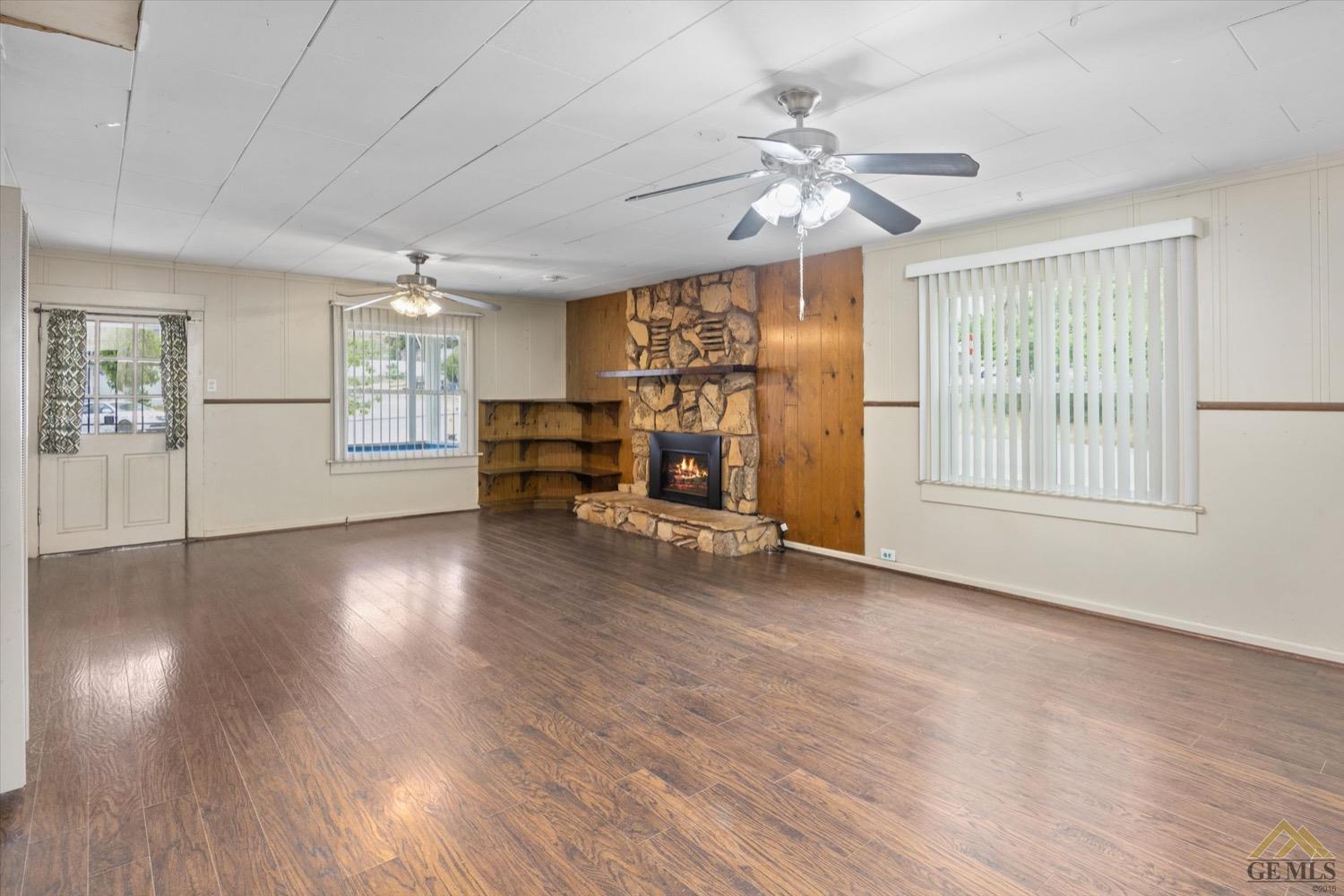 Undisclosed Address Taft, CA 93268 - Photo 6 of 21 a view of livingroom with hardwood floor and ceiling fan