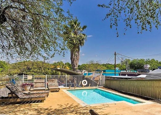 2302 East Side Drive, Unit 30 Austin, TX 78704 - Photo 21 of 22 a view of a lake with a houses