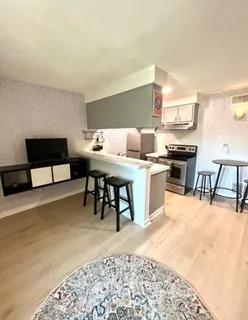 a dining room with a table and chairs