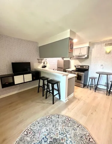 a dining room with a table and chairs