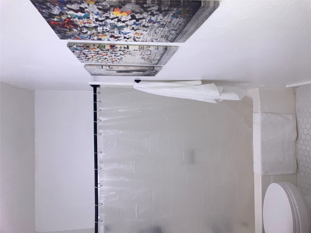 2302 East Side Drive, Unit 30 Austin, TX 78704 - Photo 10 of 22 a bathroom with a shower and a toilet