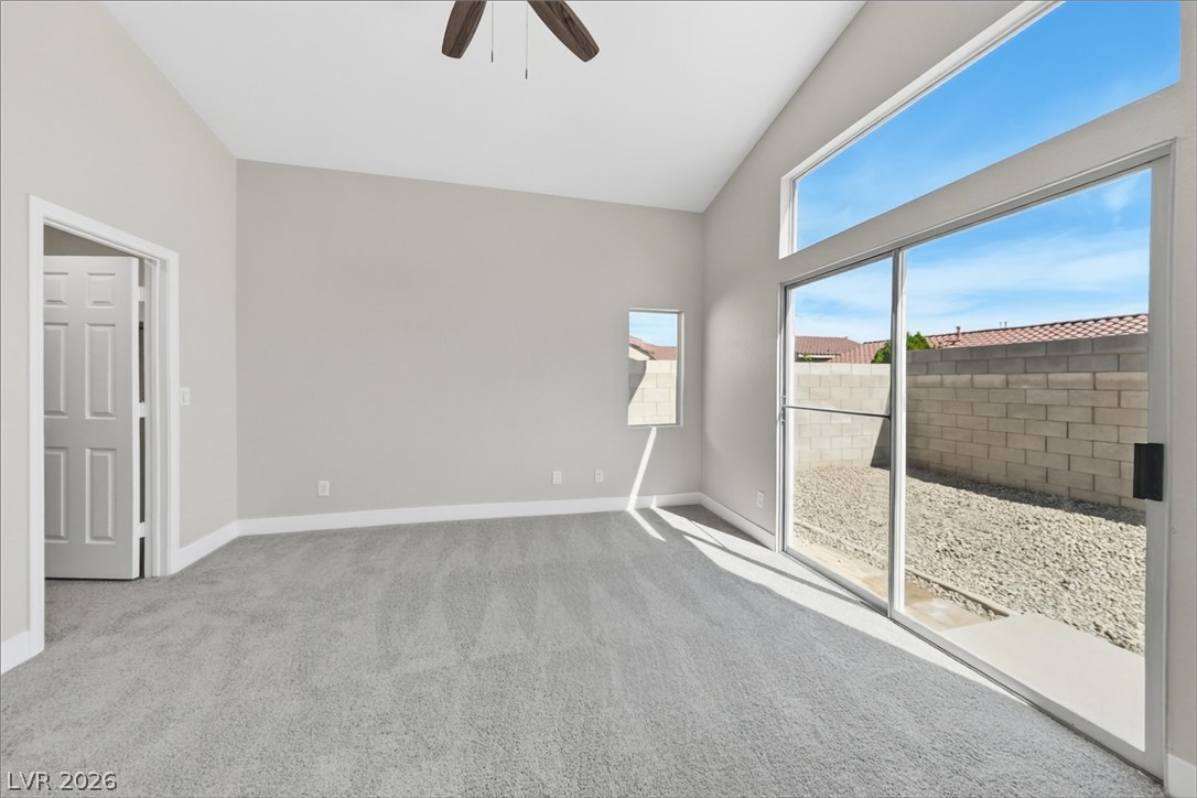 1906 Cardinal Point Street Henderson, NV 89012 - Photo 13 of 20 Vaulted ceilings and sliding glass doors create an open, airy feel in this modern space.